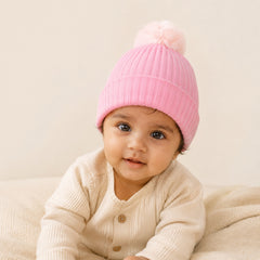 Baby pink winter hat with faux fur pompom