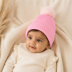 Roze baby wintermuts met faux fur pompon
