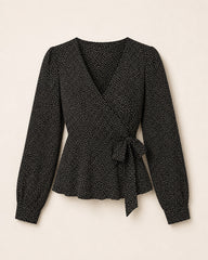 Women’s black V-neck top with white dot print