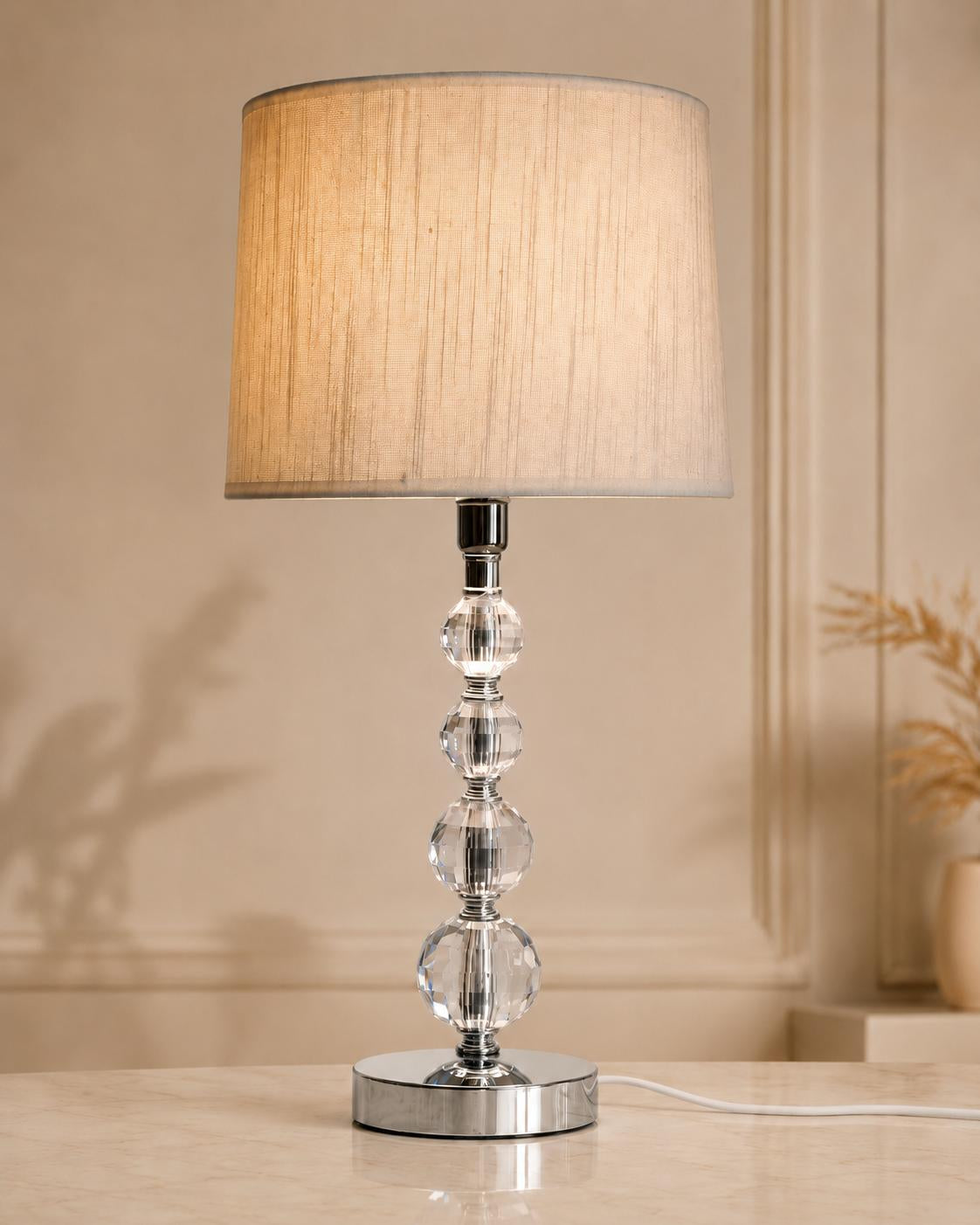 Decorative silver and glass table lamp with faceted orbs