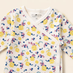 Wit baby romper met geel roze blauw bloemen