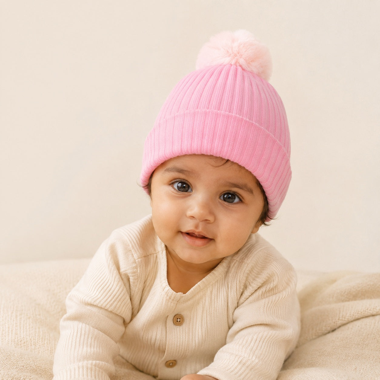Baby pink winter hat with faux fur pompom