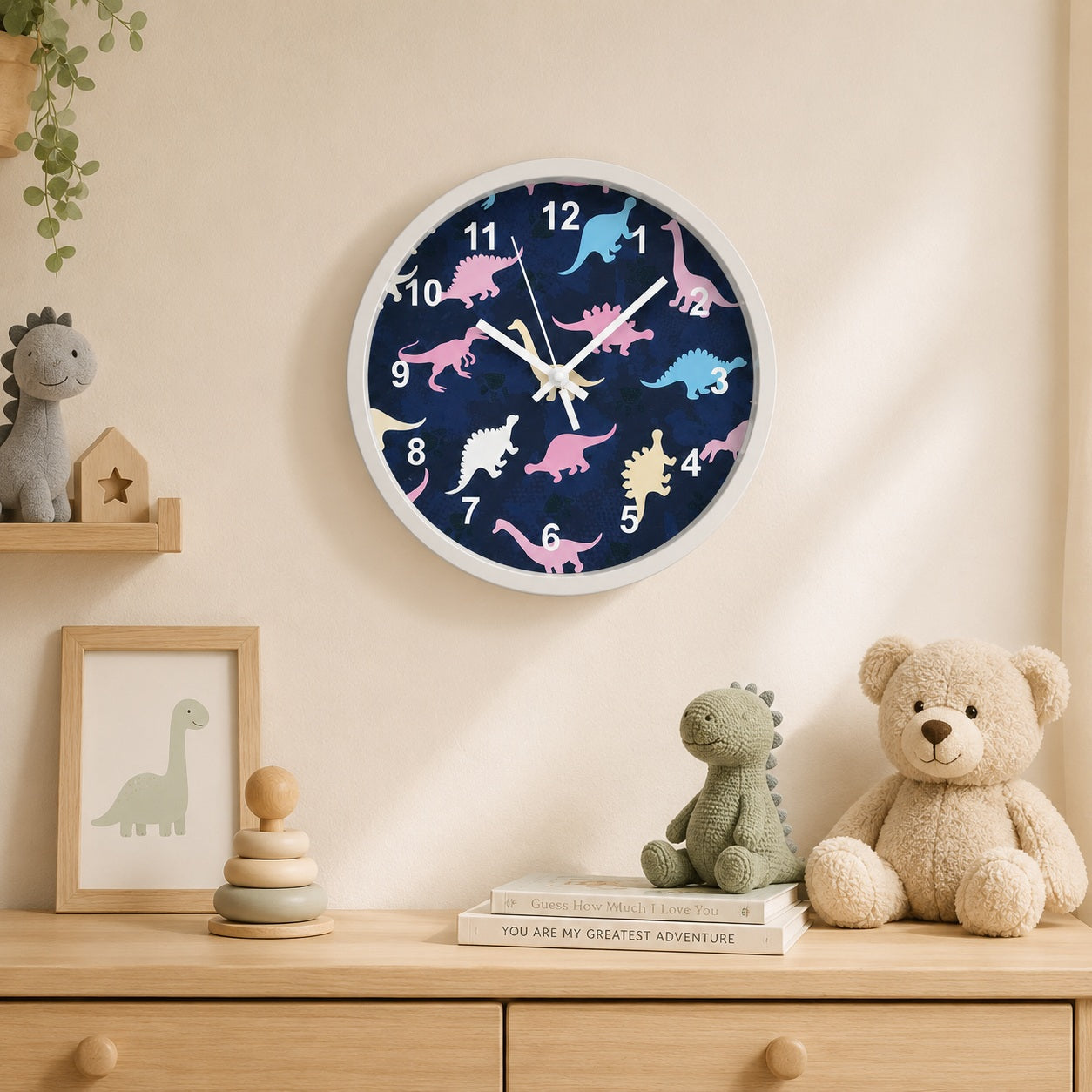 Blue dinosaur wall clock in a softly styled children’s room with wooden furniture and plush toys