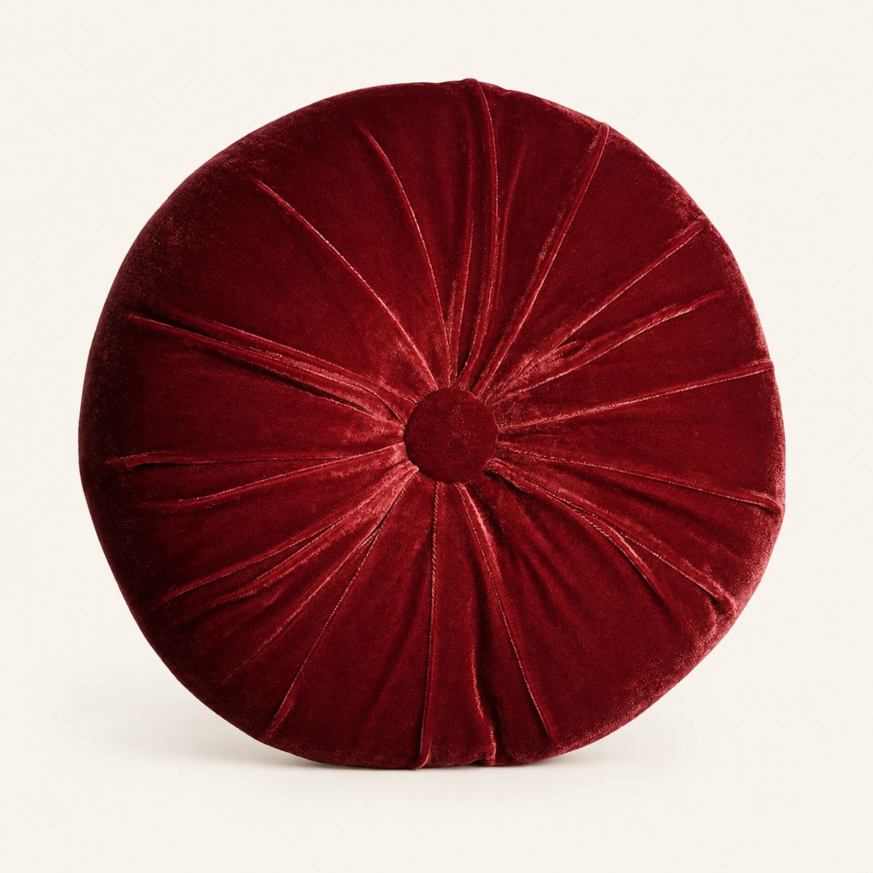 Soft round pumpkin cushion in deep red velvet fabric