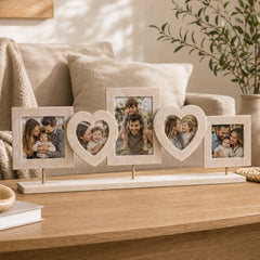 Wooden photo collage frame with family photos displayed in a warm neutral living room