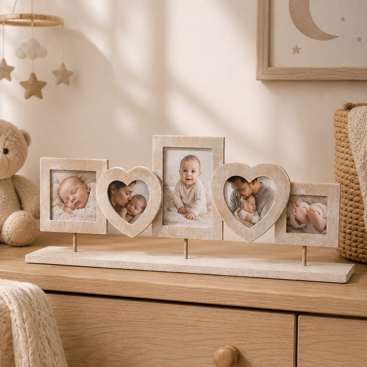 Decorative photo collage frame with baby photos in a soft beige nursery