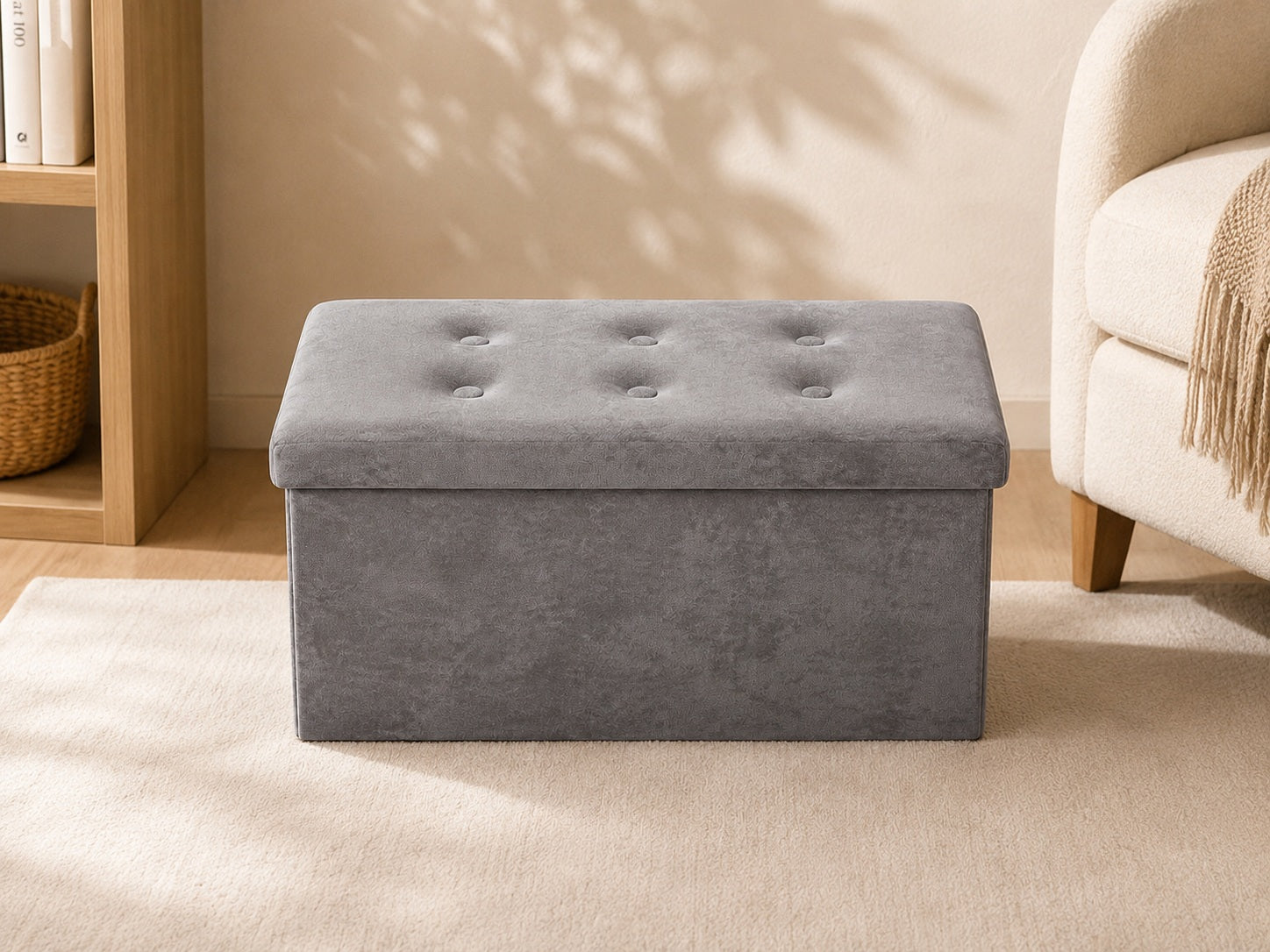 Grey upholstered storage bench in a minimalist living room