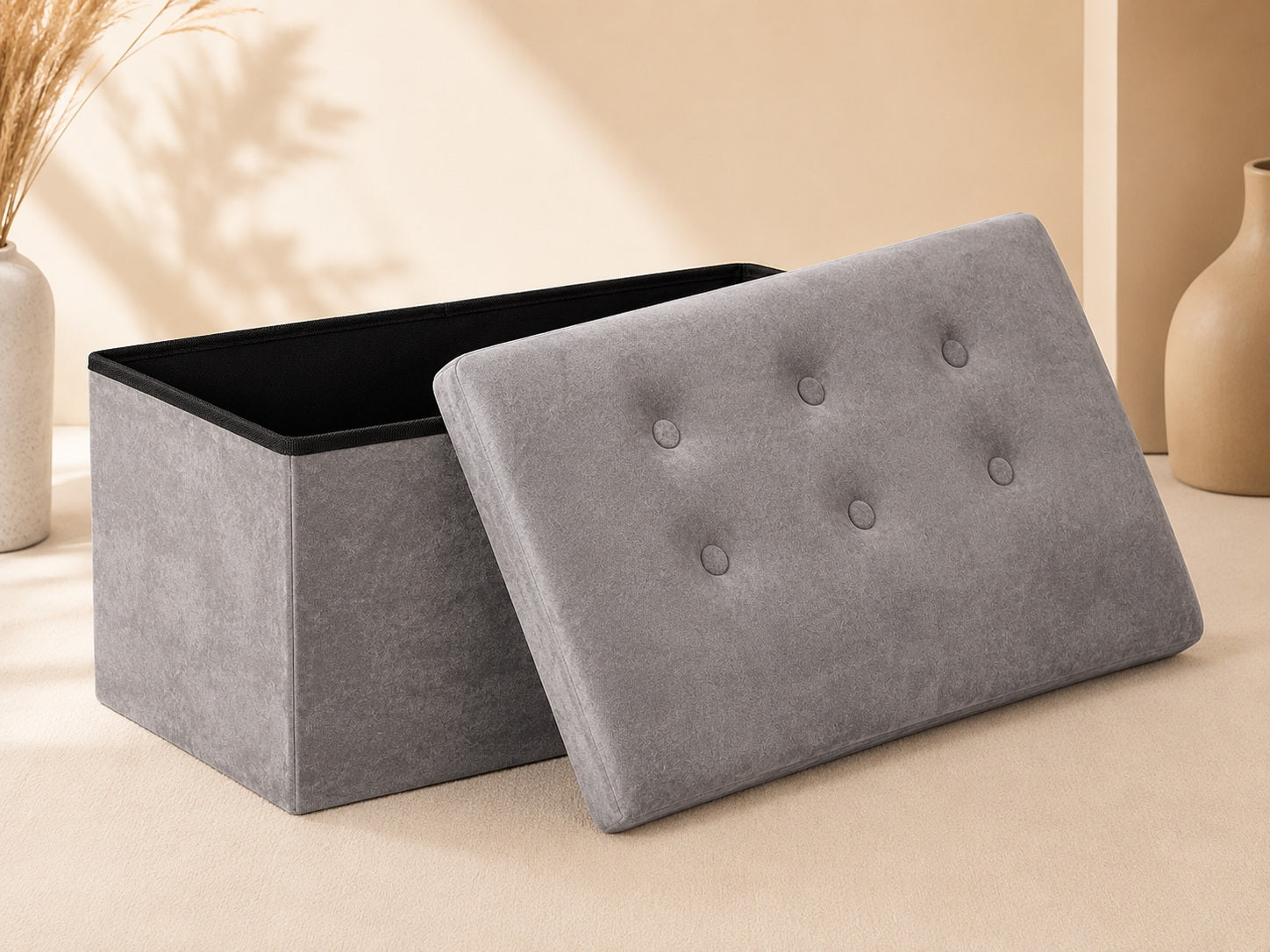 Open grey velvet storage bench with removable lid and black interior