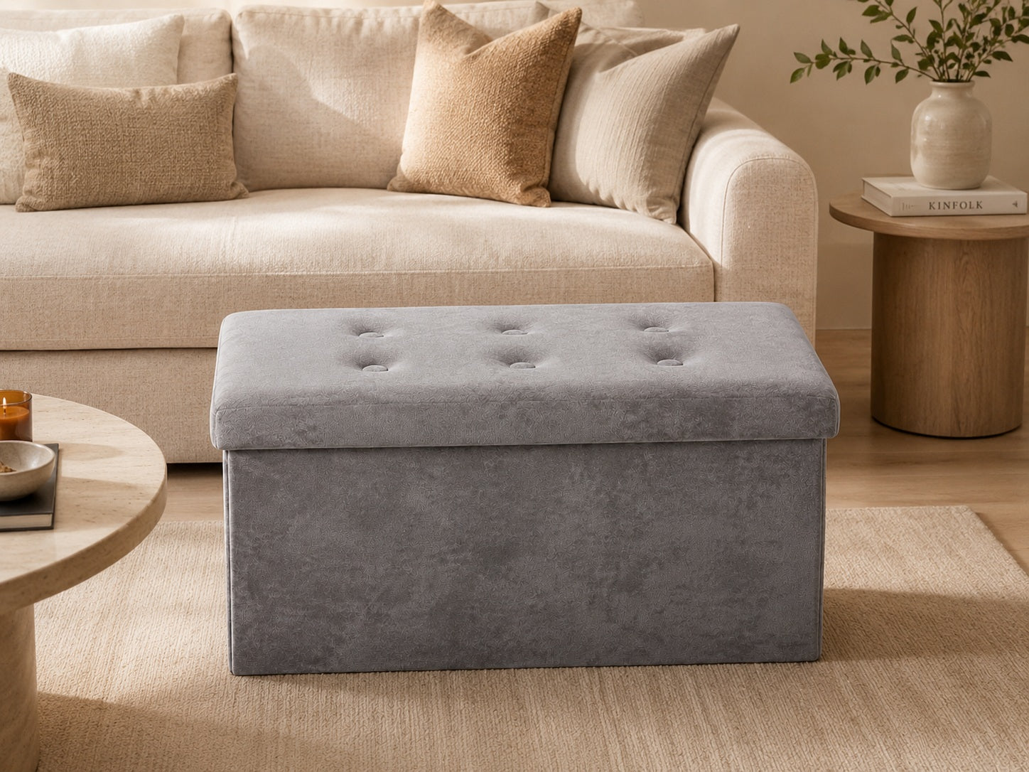 Grey storage ottoman in a warm neutral living room