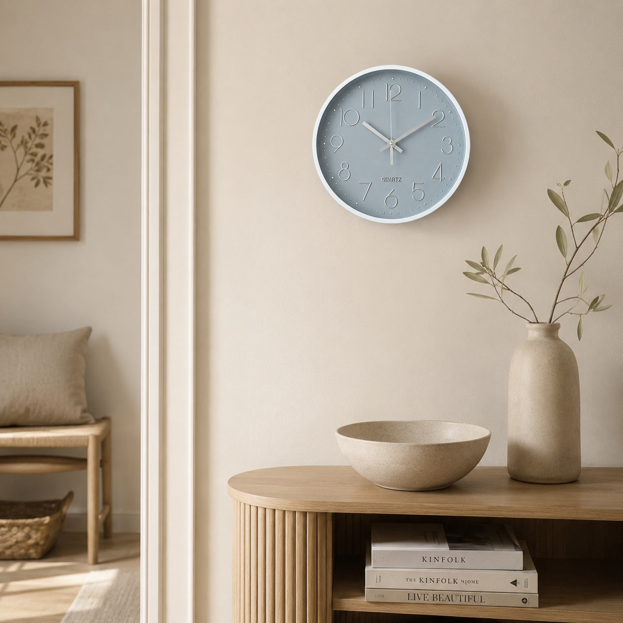 Grey and silver wall clock in a minimalist Scandinavian-style interior