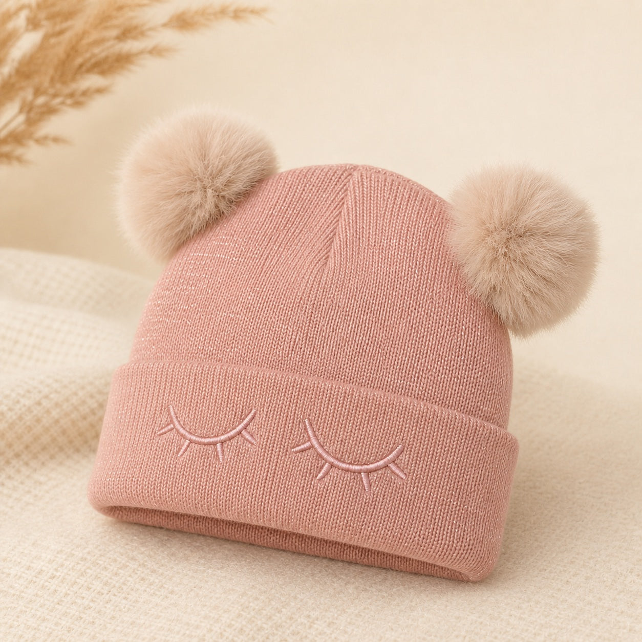 Roze knitted kinderen winter muts met embroidered sleepy eyes