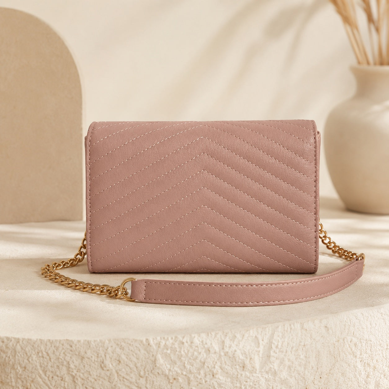 Elegant pink leather bag with compartments and zip pocket