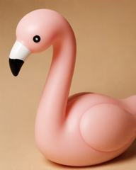 Close-up of pink flamingo night light with black and white beak