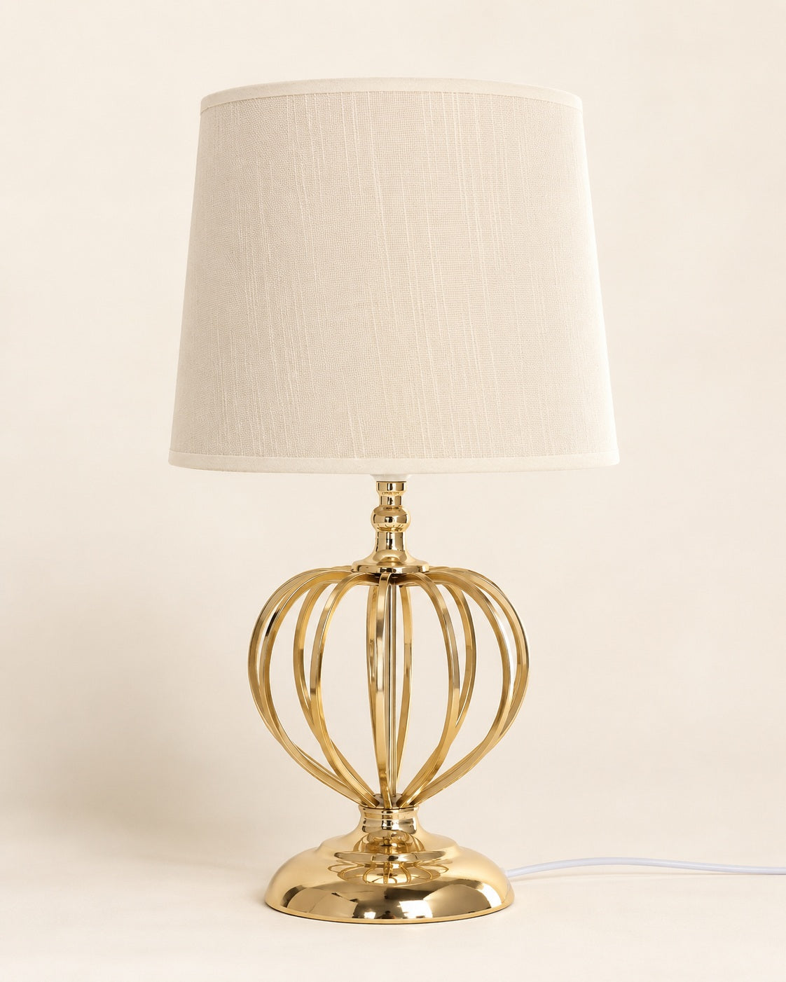 Elegant table lamp with white shade and gold base