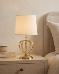 Seychelle gold table lamp with white fabric shade