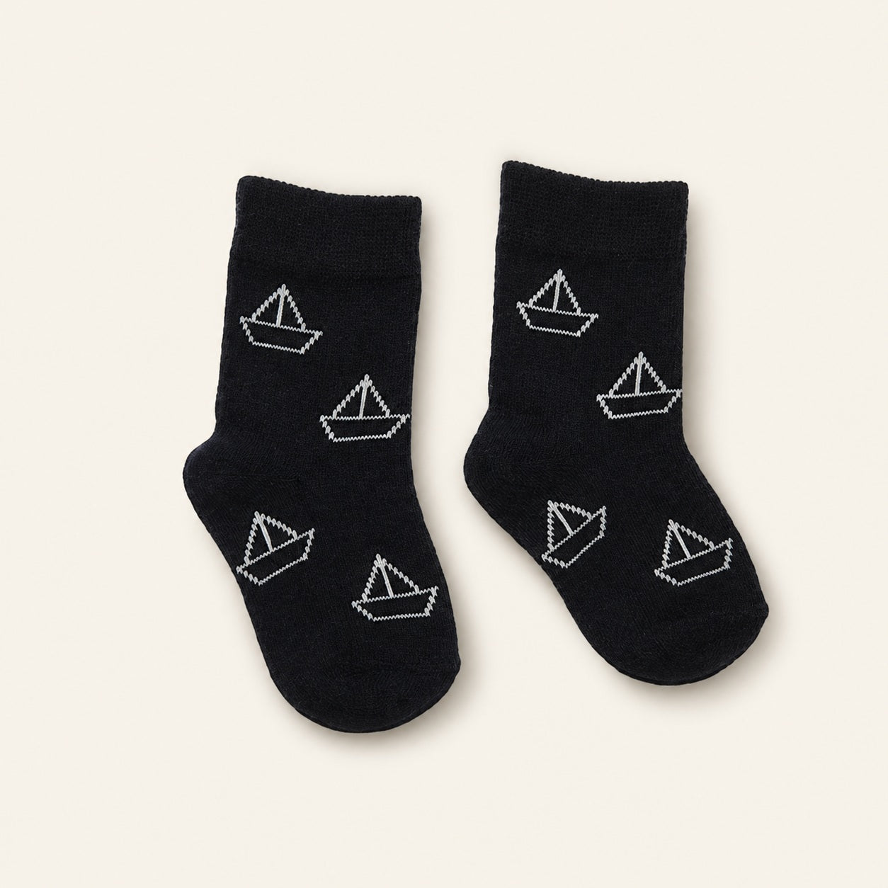 Black and white baby socks with boat and shoe designs