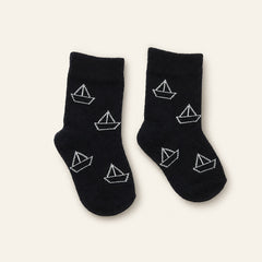 Black and white baby socks with boat and shoe designs