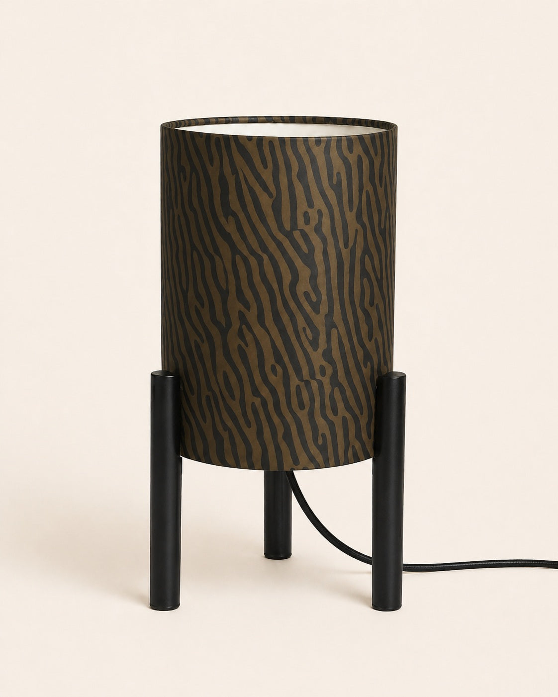 Modern tripod table lamp with patterned gold shade