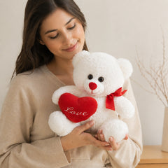 Zacht wit pluche teddybeer beer holding hart