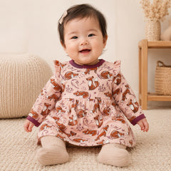 Tiny One baby dress in blush pink with merlot trim