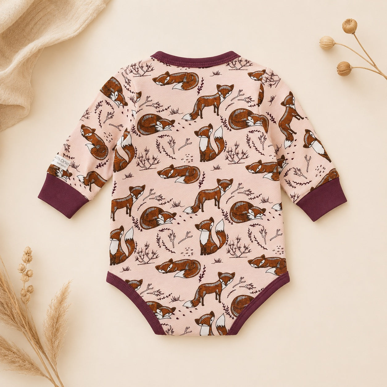 Baby girl wrap romper with foxes made from organic cotton