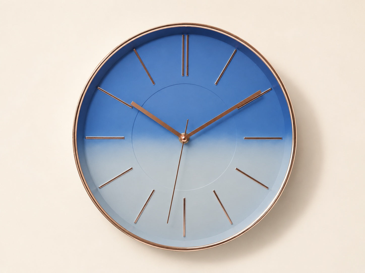 Modern blue gradient wall clock with rose gold rim