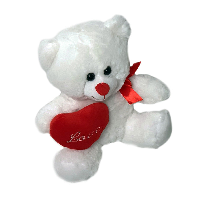 Teddy bear with bow holding heart love